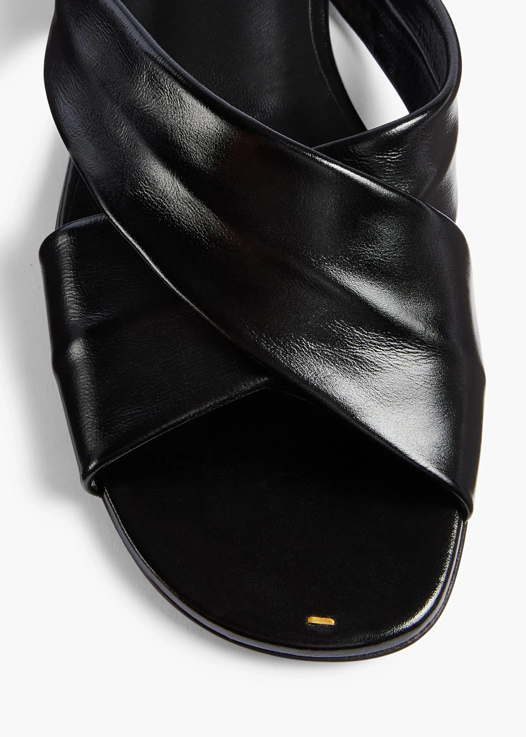 Liria Flat Sandal in Black Glazed Leather