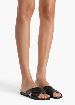Liria Flat Sandal in Black Glazed Leather